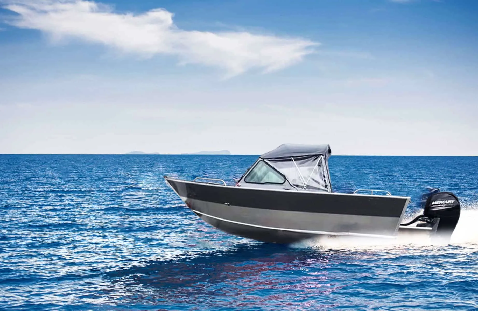 Shelter 21 aluminum fishing boat with a soft top running across open water